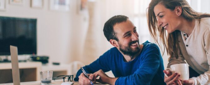 A couple checks on their money market account online.