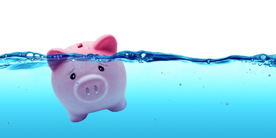 A piggy bank under water represents drowning in debt.