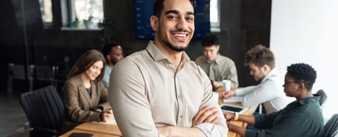 A young professional poses as a meeting commences.