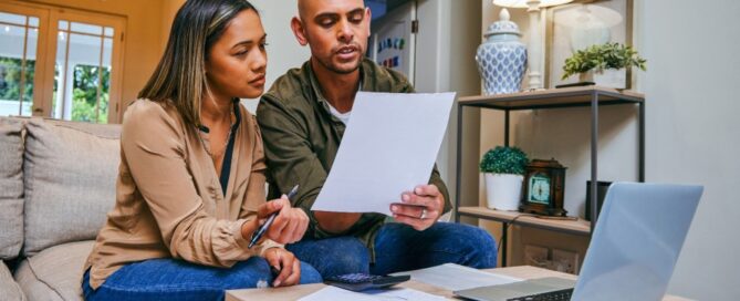 A young couple goes over their expenses.