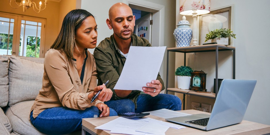 A young couple goes over their expenses.